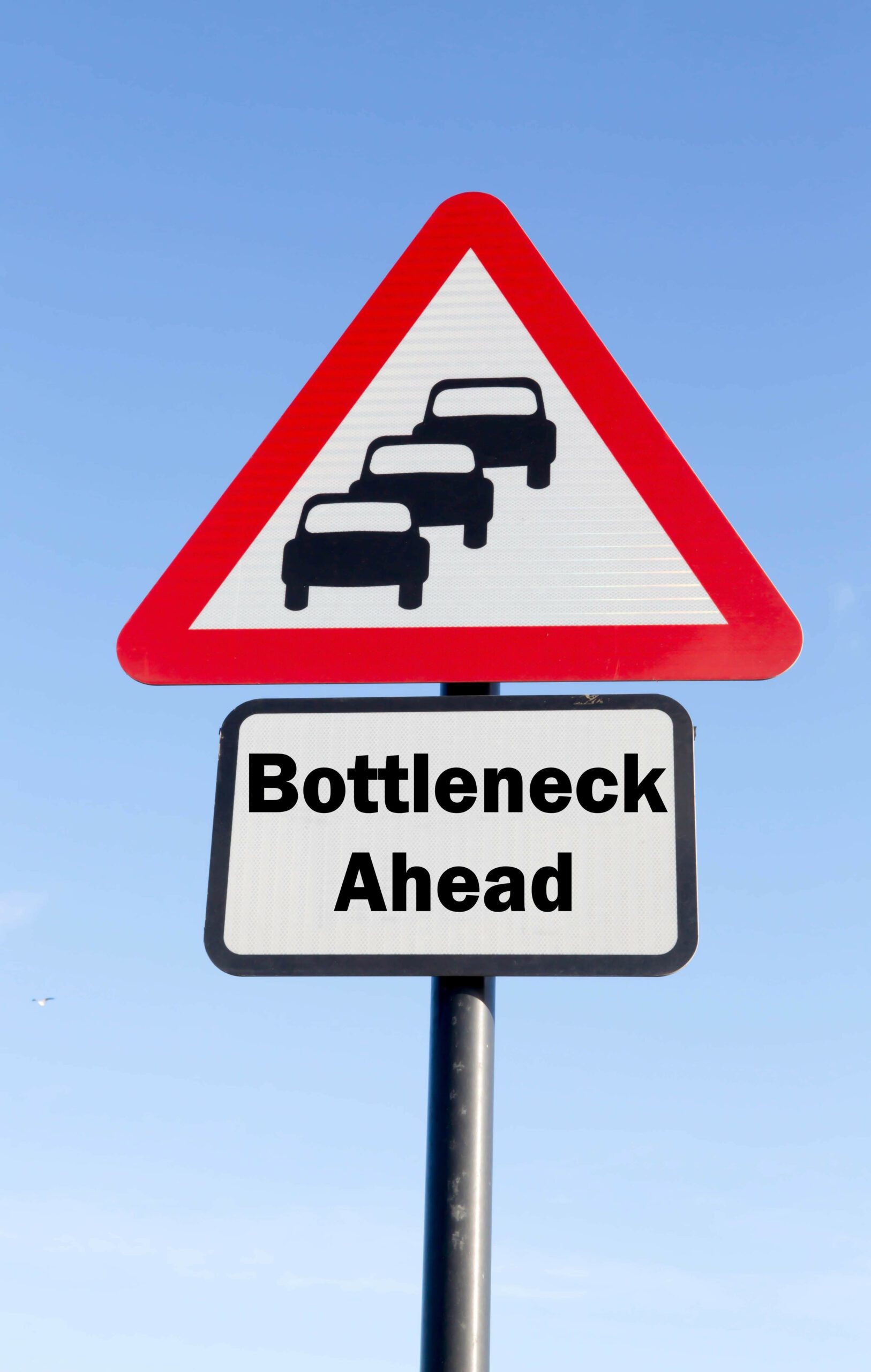 A street sign warning drivers of a traffic bottleneck