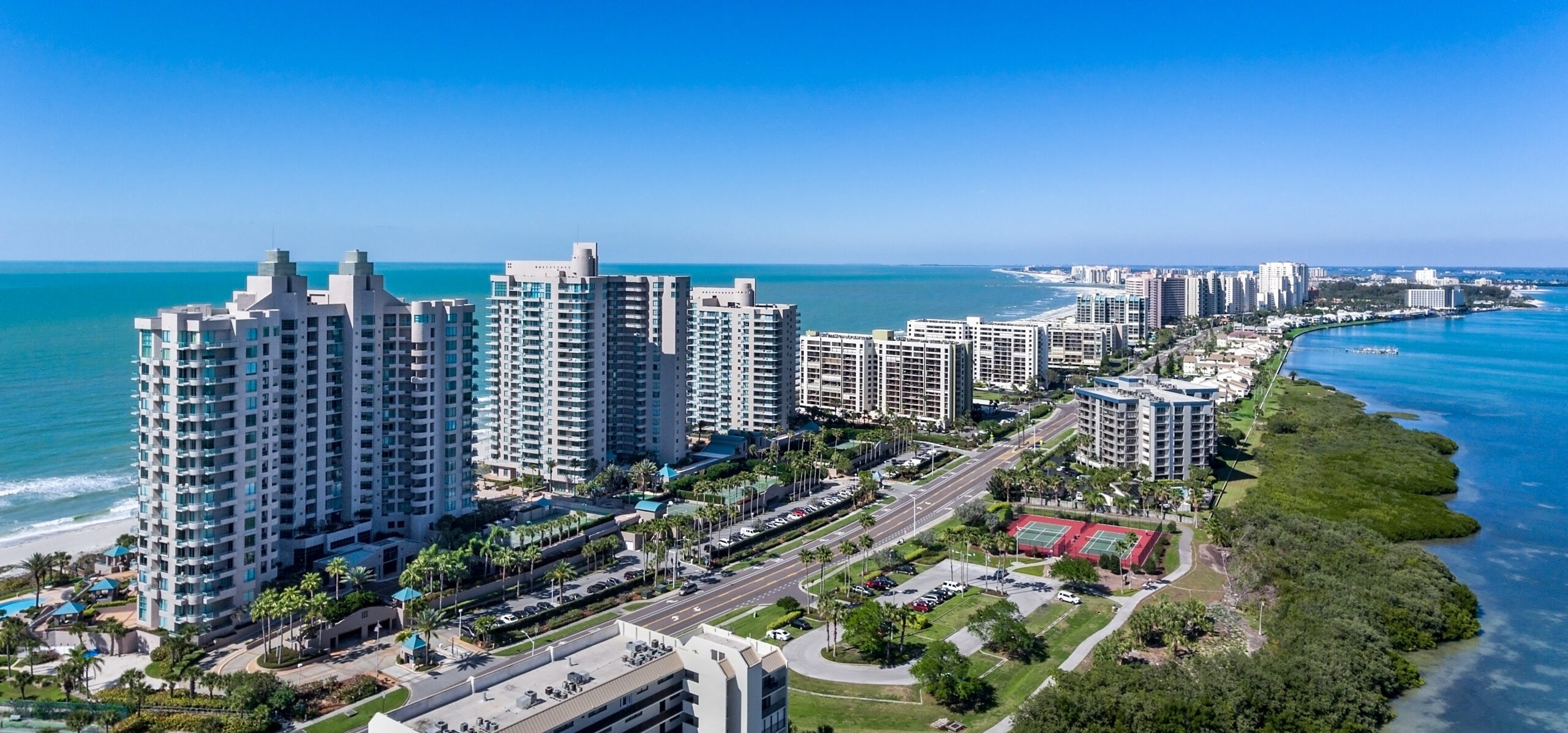 an aerial view of the city of clearwater beach with the ocean